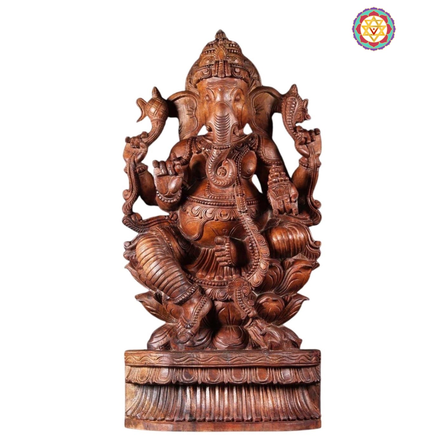 Close-up of polished wooden Ganesha idol showing intricate carving details and serene expression — handcrafted temple art