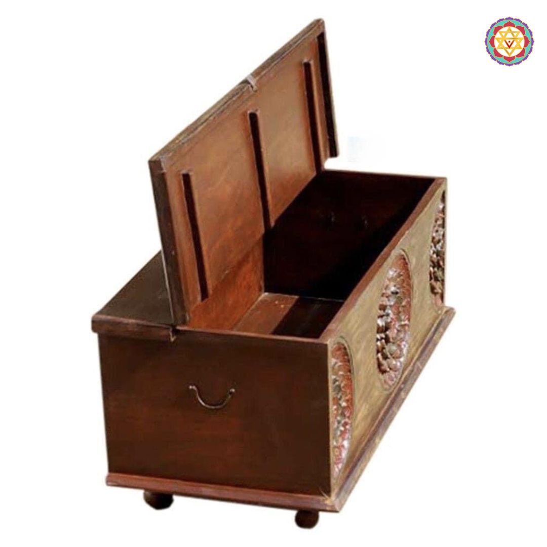Close-up of ethnic trunk box — detailed wood carving and rustic polish, artisan-crafted coffee table furniture