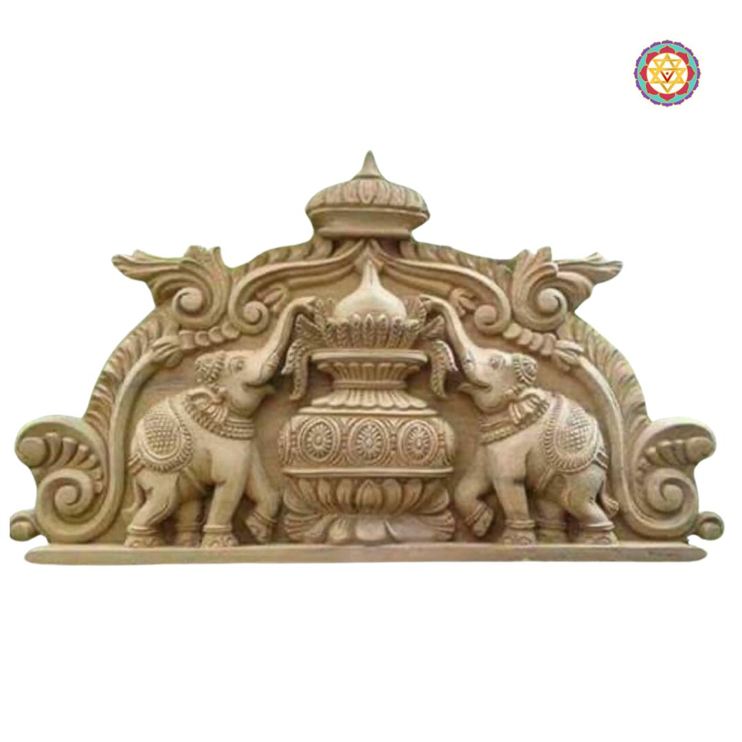 Close-up of carved Kalash and elephant details — intricate craftsmanship, antique gold brown finish for ethnic entrances