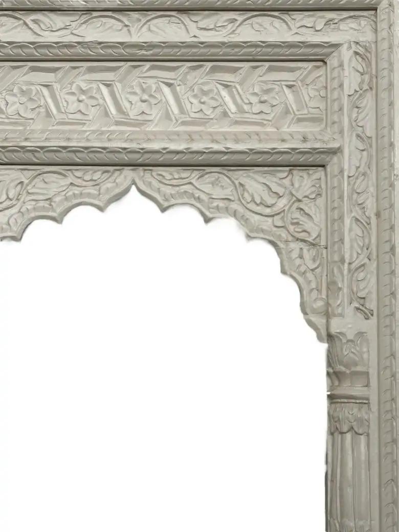 Carved arch detailing — Gulab Jharoka floral mango wood mirror frame.