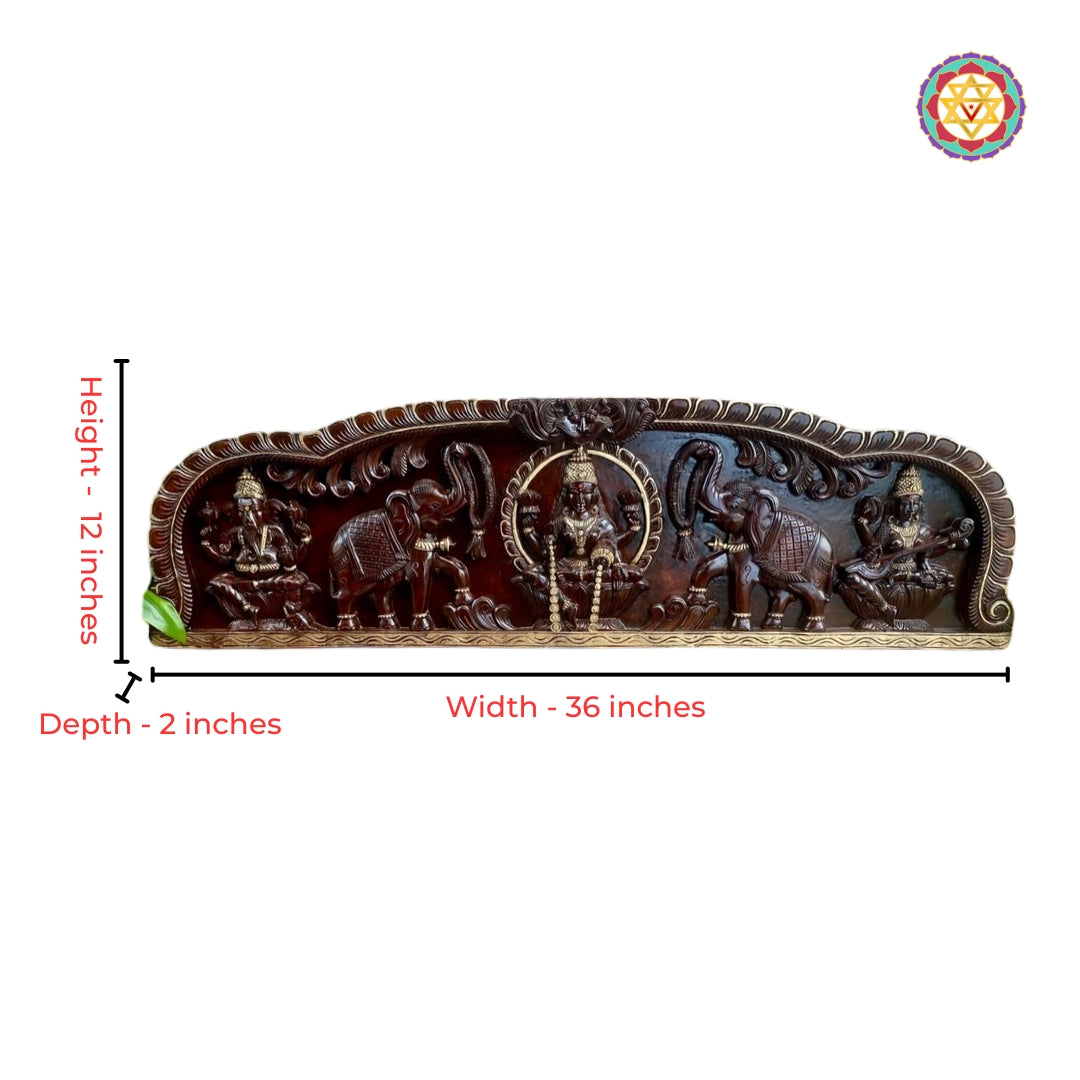 Close-up view of Gajalakshmi carving with antique gold heritage detailing