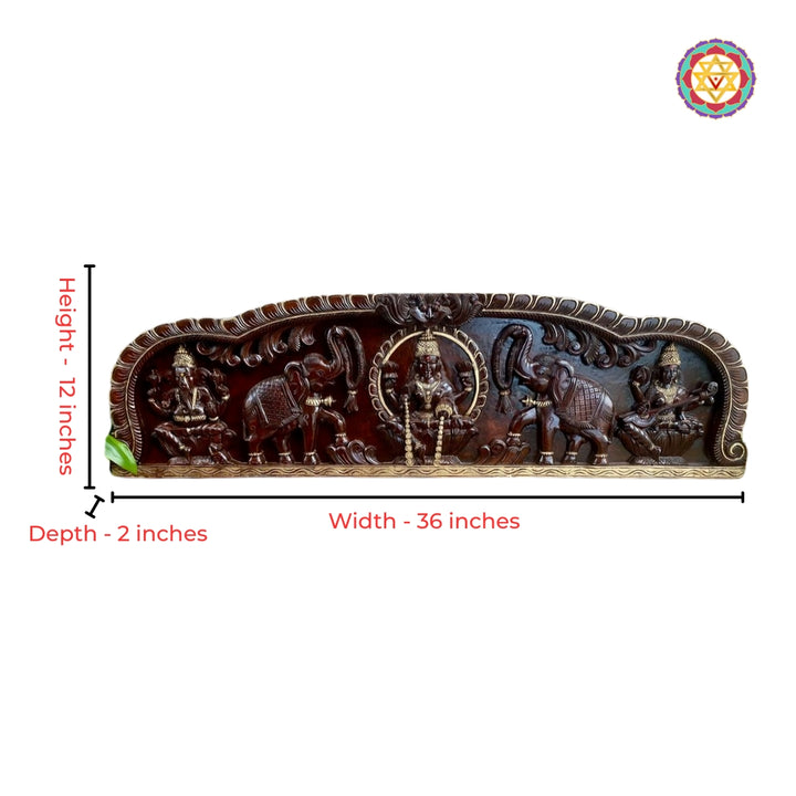 Close-up view of Gajalakshmi carving with antique gold heritage detailing