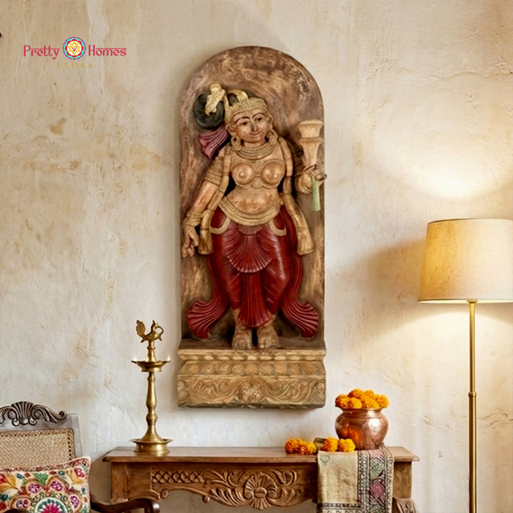 Handcarved apsara yakshi wooden panel holding a blooming flower motif