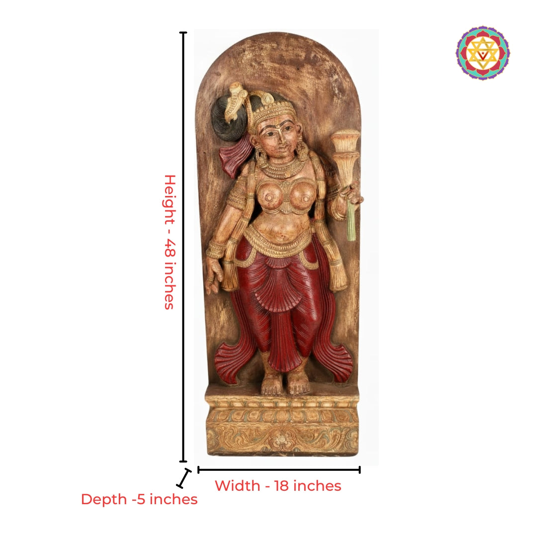 Close-up view of apsara yakshi carving with floral detailing in wood panel