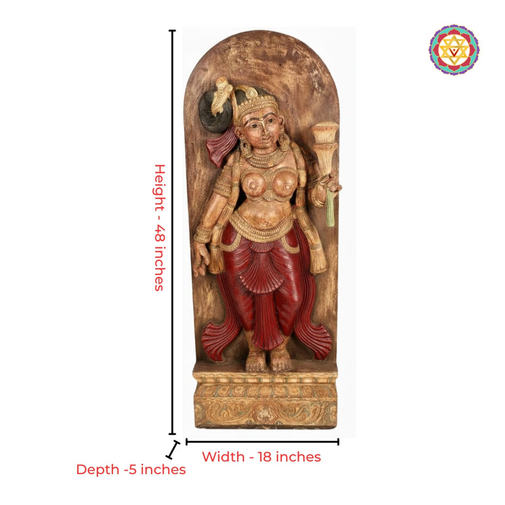 Close-up view of apsara yakshi carving with floral detailing in wood panel