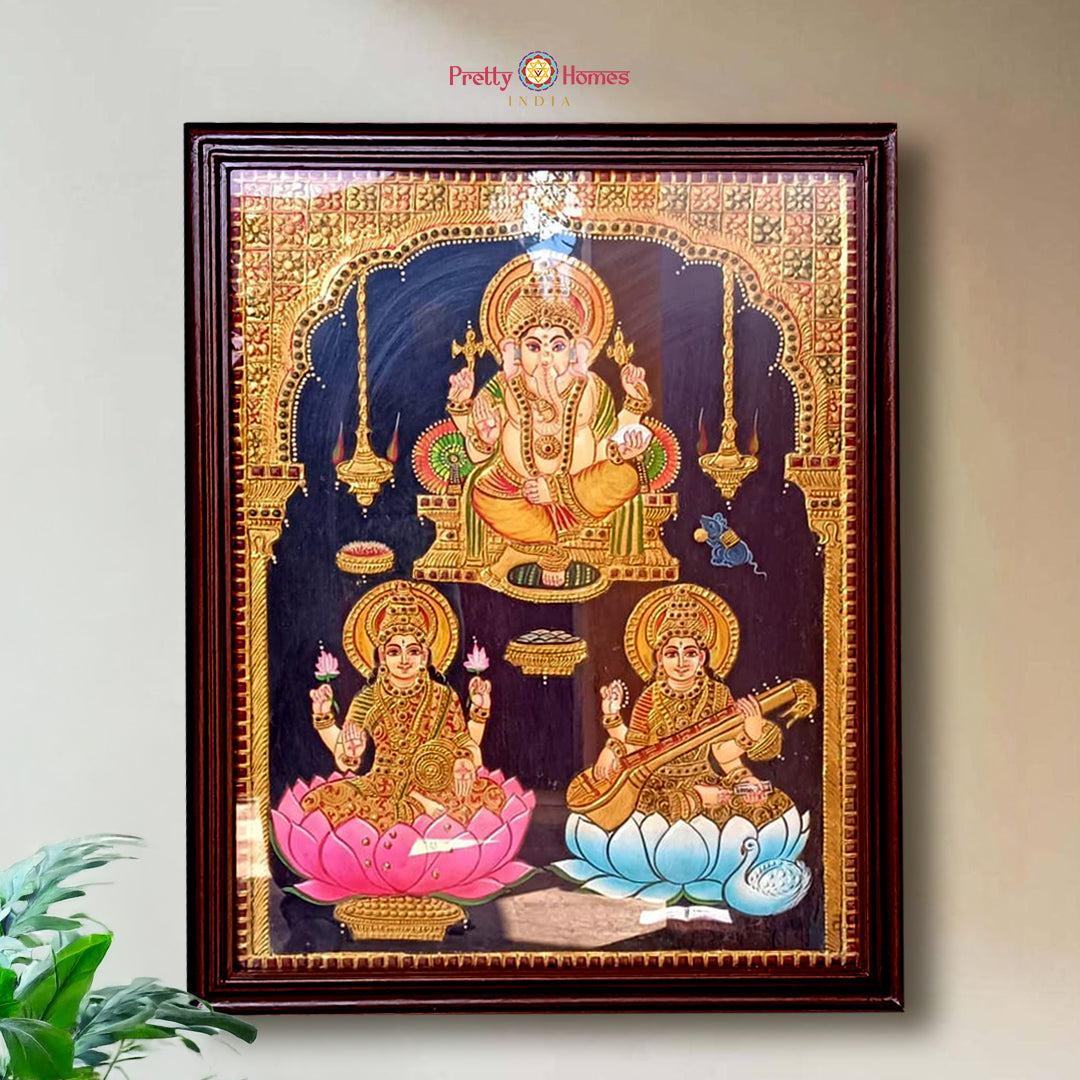Antique Ganesh Lakshmi Saraswati Tanjore painting with 22 carat gold and teak wood frame