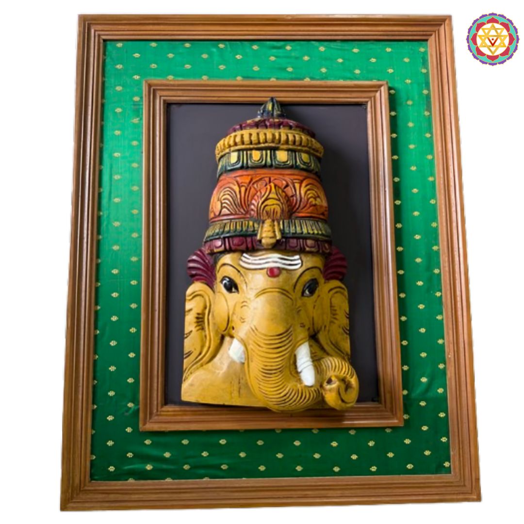 lord ganesha wooden face wall hanging with green silk backdrop