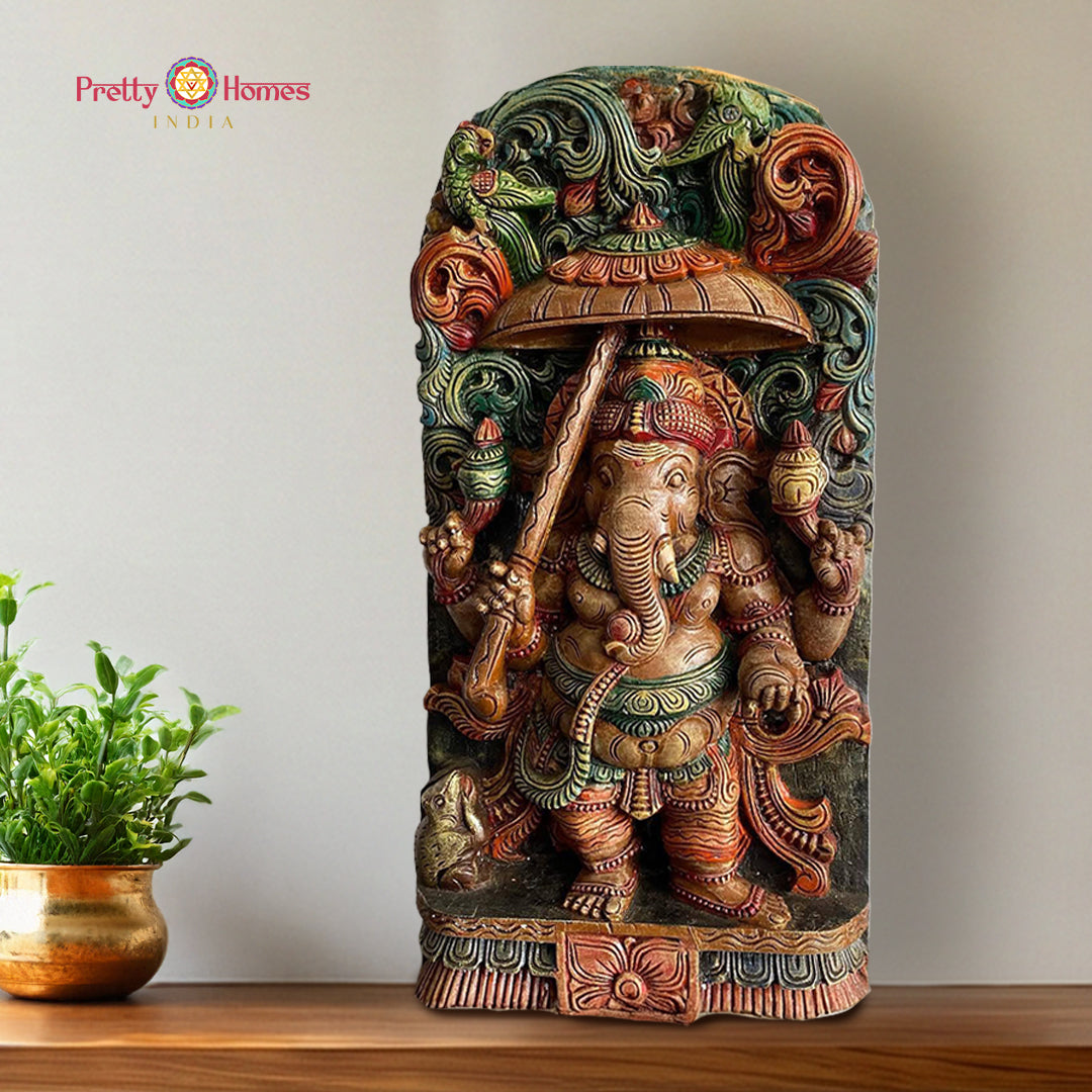 Hand carved ganesha statue with umbrella canopy wooden sculpture