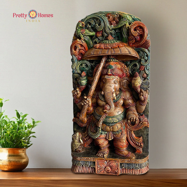 Hand carved ganesha statue with umbrella canopy wooden sculpture