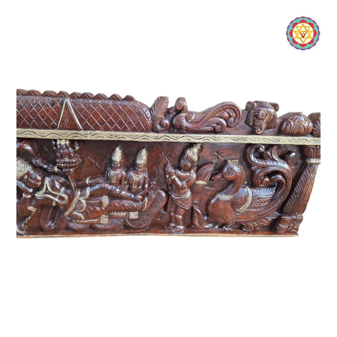 Intricate wall carving depicting Lord Vishnu resting on Sheshnag, flanked by Garuda and decorative peacocks.