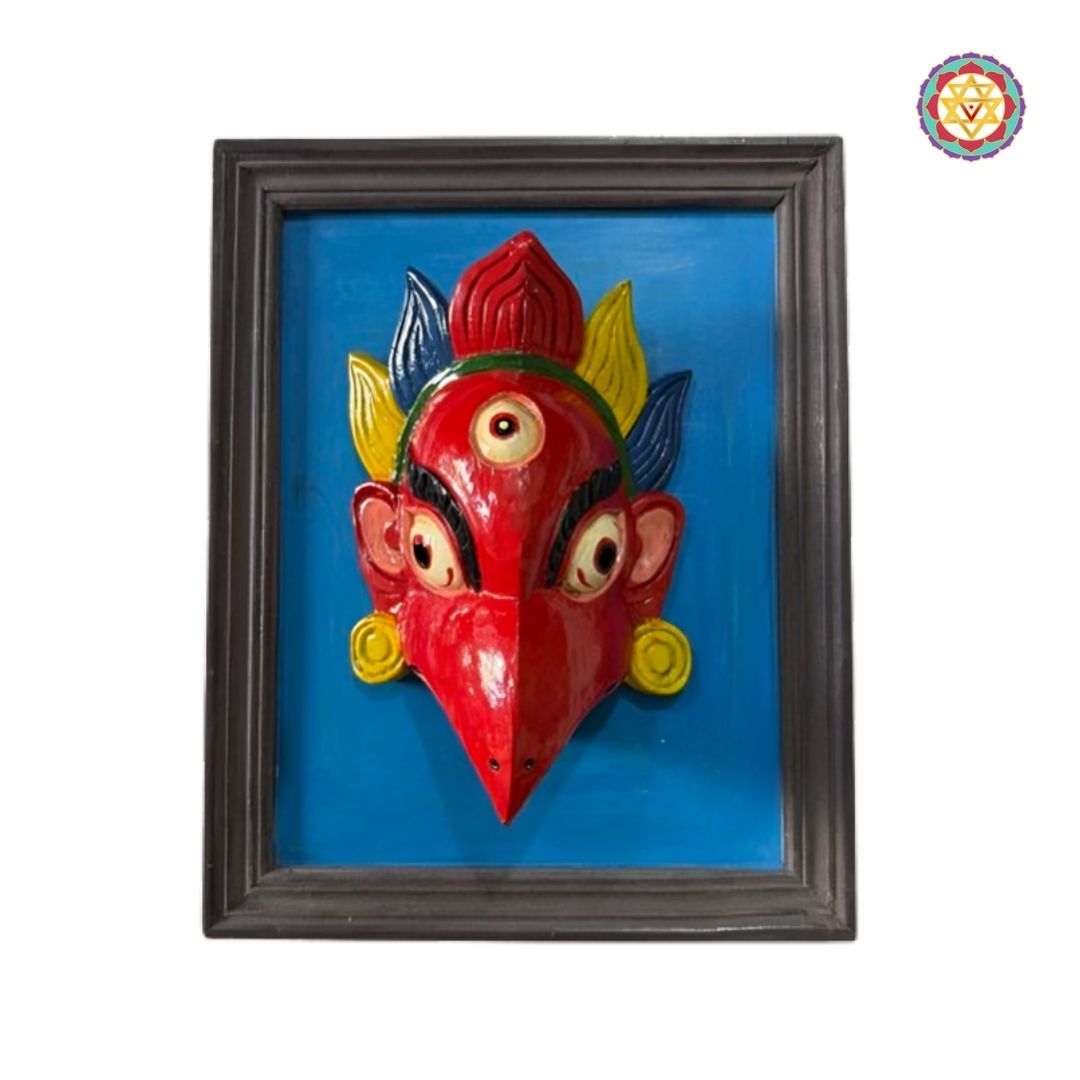 Intricate hand-painted details and vibrant colors on a traditional wooden Garuda wall mask.