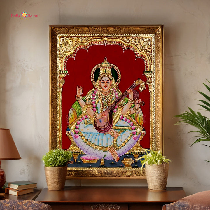 Hand painted paintings of Goddess Saraswati in Tanjore style.