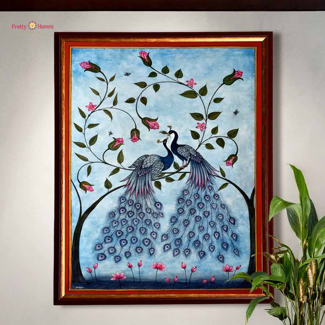 Hand painted paintings of a peacock pair on a tree branch.