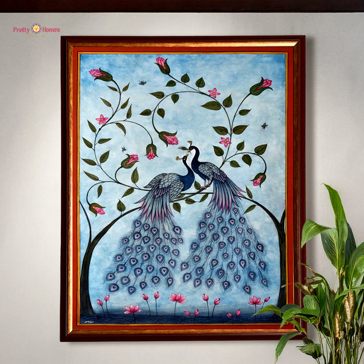 Hand painted paintings of a peacock pair on a tree branch.