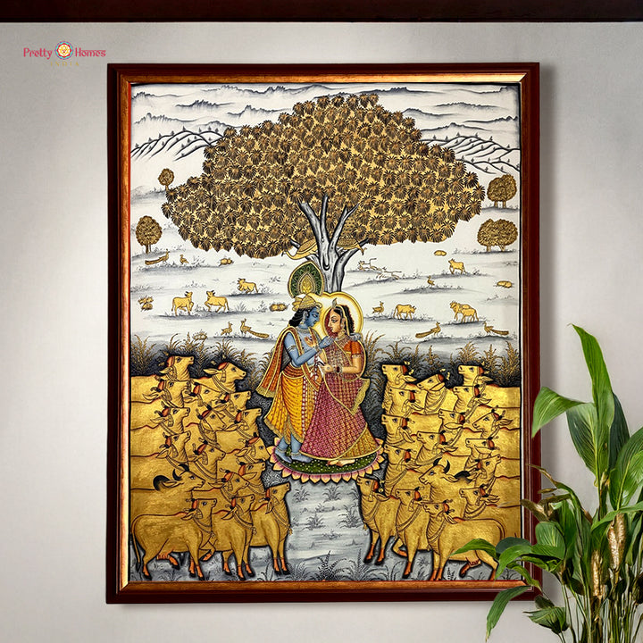 Hand painted paintings of Radha Krishna under a sacred tree.