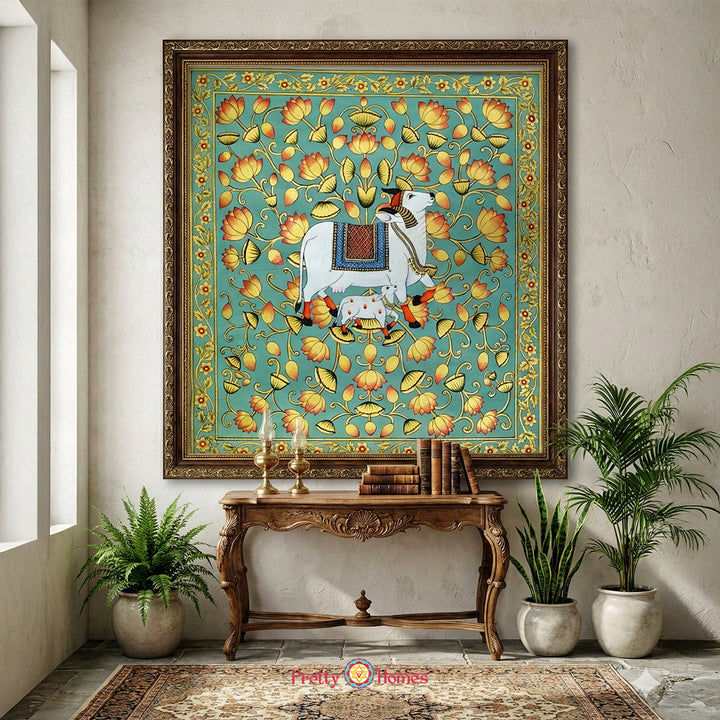 Handpainted Pichwai cow painting with golden detailing and lotus pond turquoise background wall art