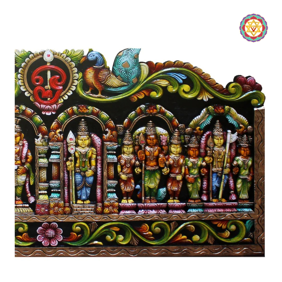 Close-up heritage craftsmanship of Murugan wooden wall decor panel