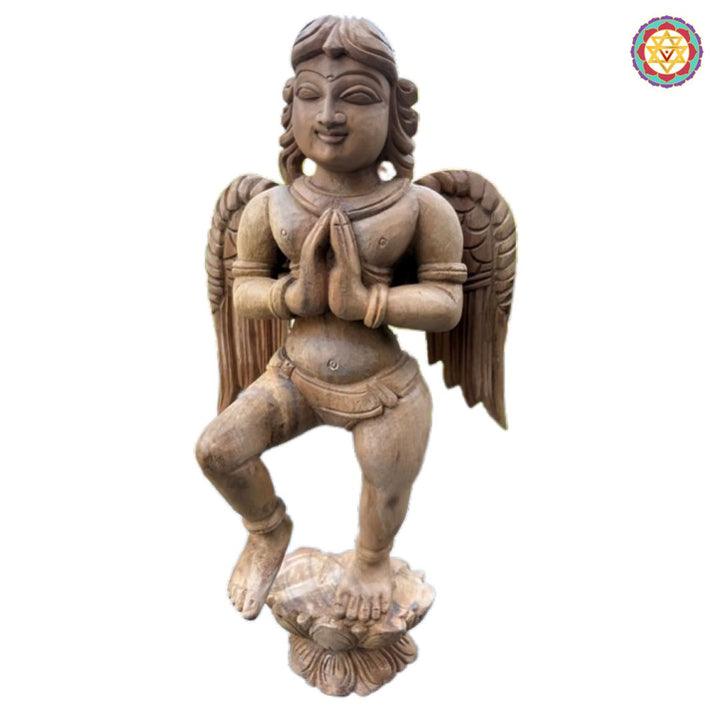 Detailed teak wood wall sculpture showcasing a celestial Gandharva with deep-carved textures.