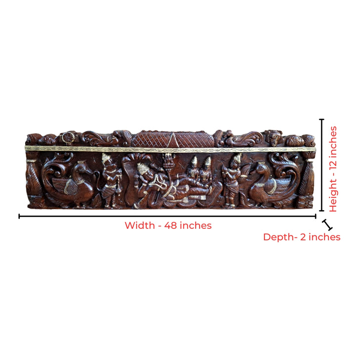 Intricate wood carving of Vishnu with Garuda and peacocks