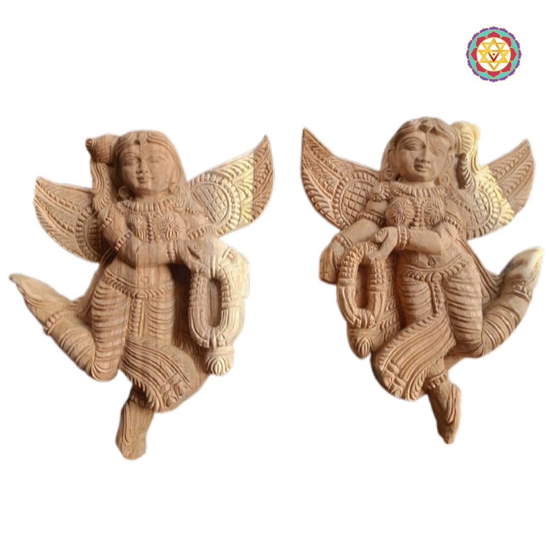 Decorative wooden Gandharva angel wall hanging pair with detailed garland carving