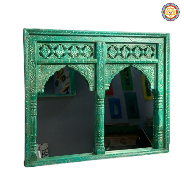 Detailed wooden Jharokha wall art showcasing twin arched mirrors and traditional carvings.