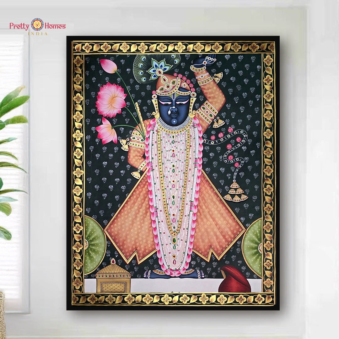 Traditional Shrinathji Pichwai painting with ornate golden border