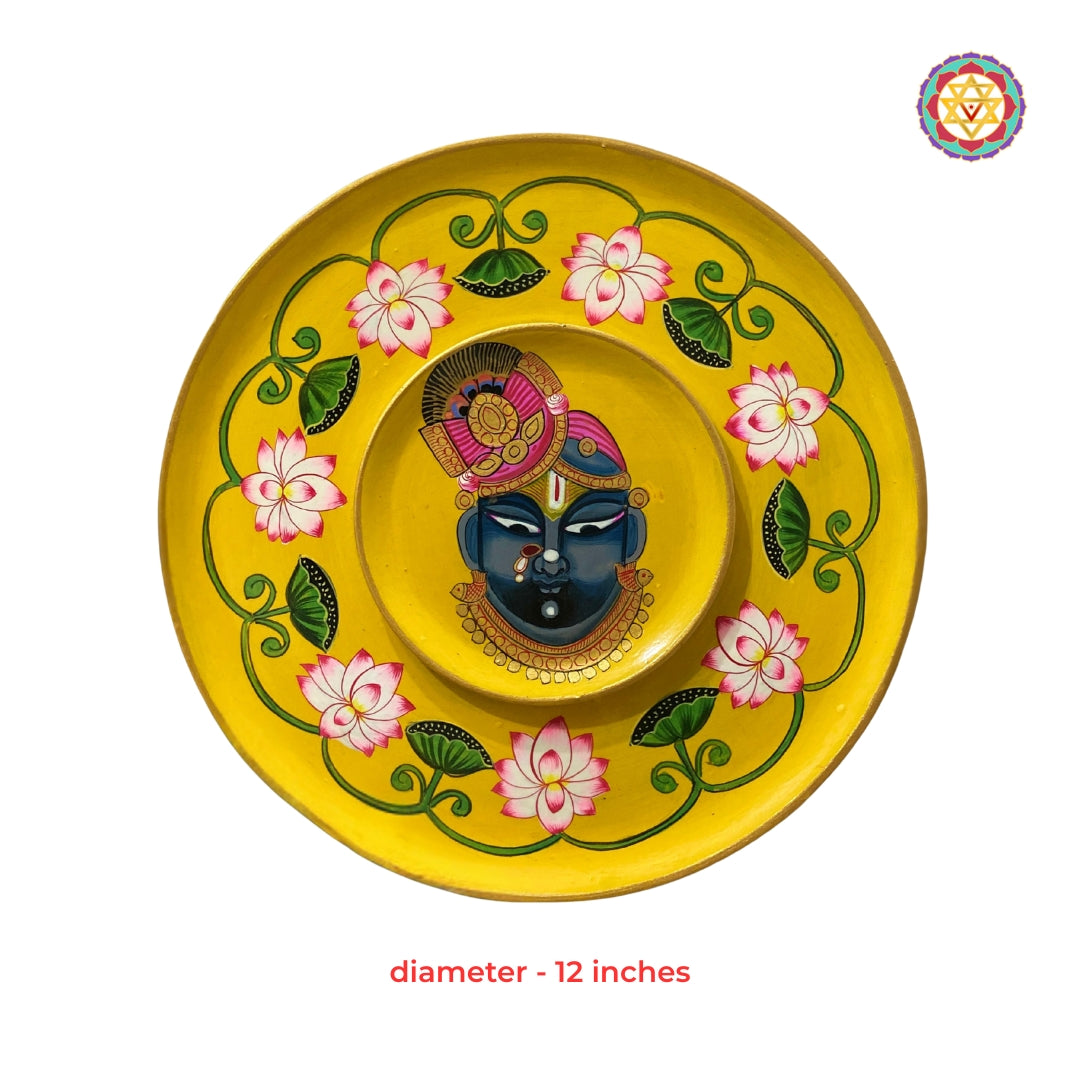Shrinathji Pichwai decorative wall plate surrounded by sacred lotus motifs traditional Indian art