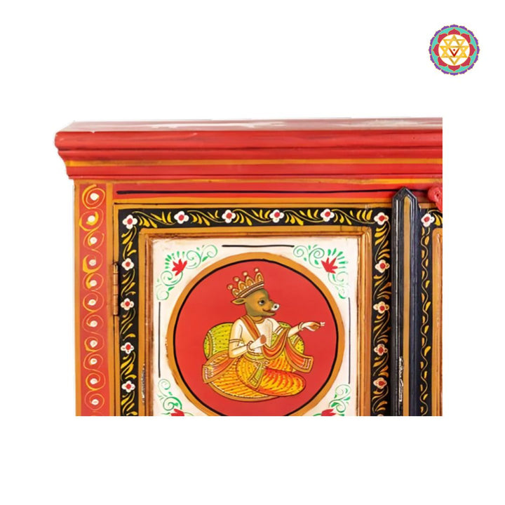 wooden cabinet with traditional carvings and artwork
